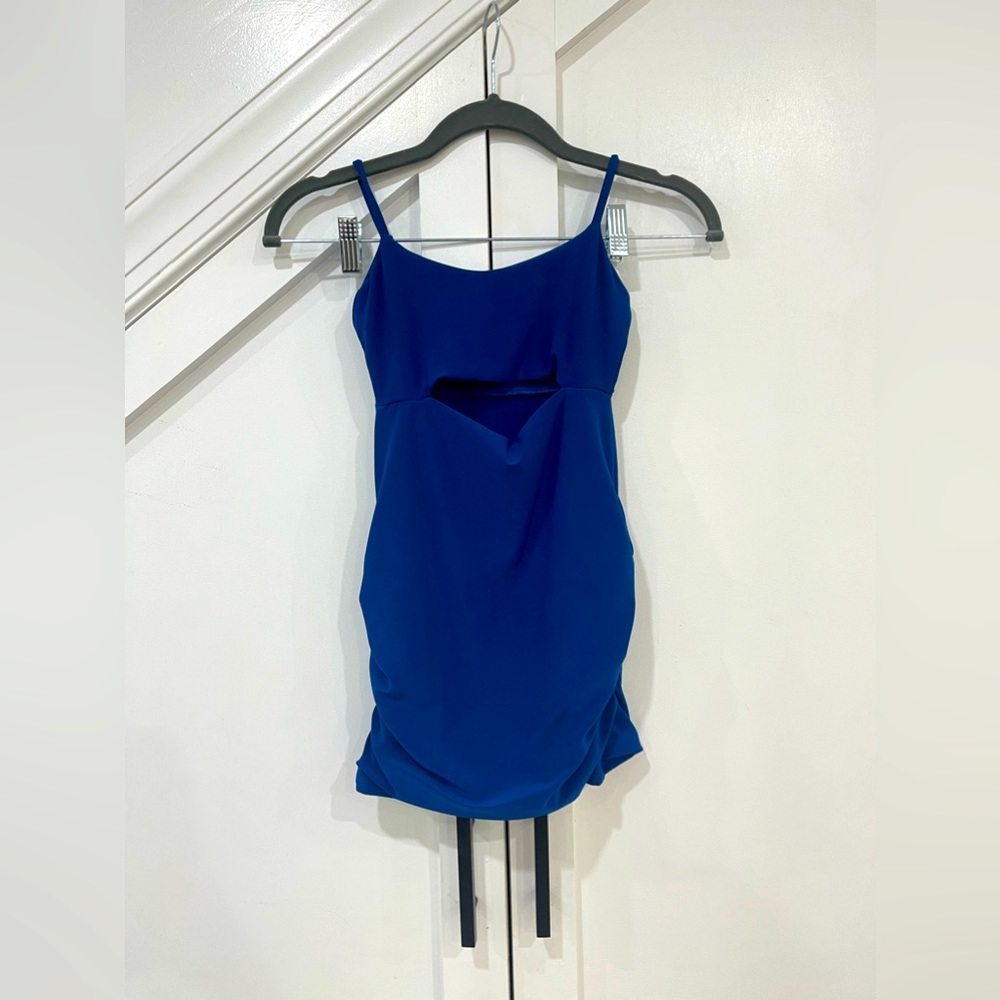 Never worn, royal blue skin tight dress, size 7/8, from Cheryl Creations kids.